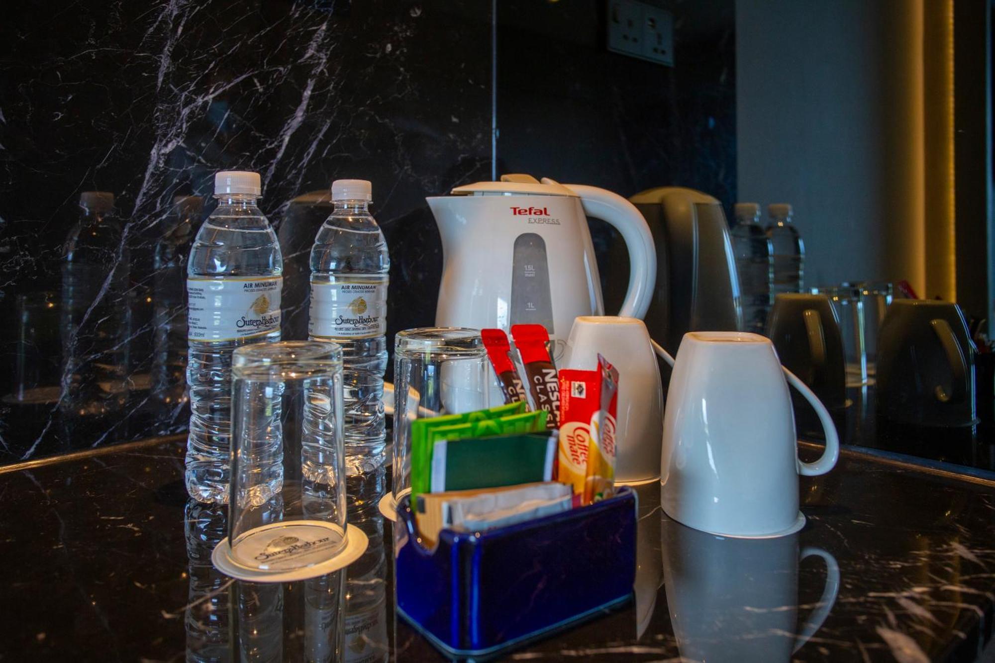 The Pacific Sutera Hotel Kota Kinabalu Eksteriør billede Bottled water in a hotel room